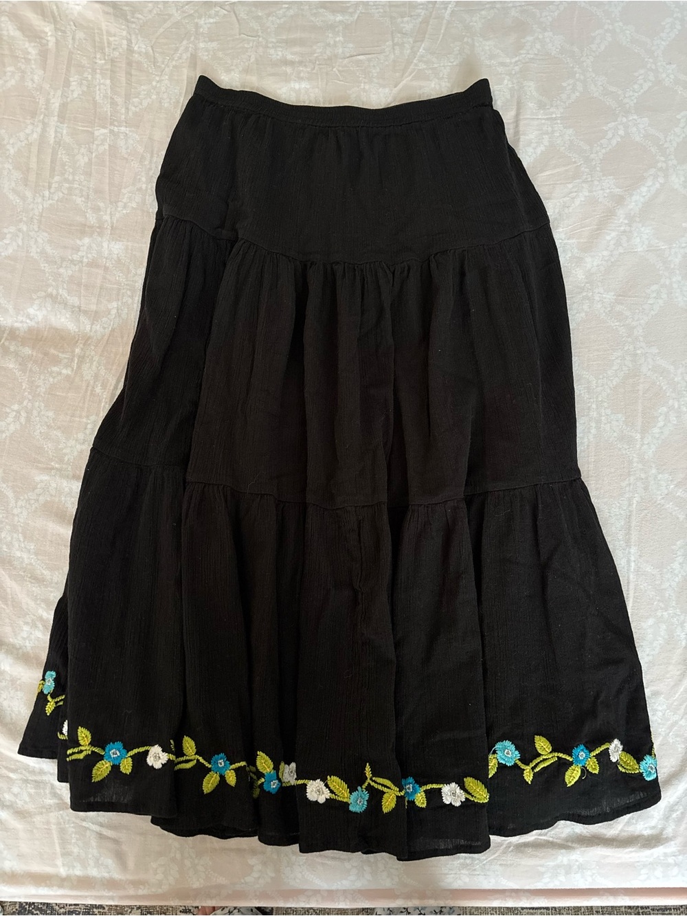 Tiered maxi skirt with floral embroidery on the bottom